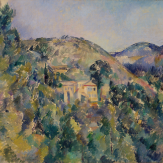 Pale buildings nestle among green trees beneath rolling hills and a light blue sky.