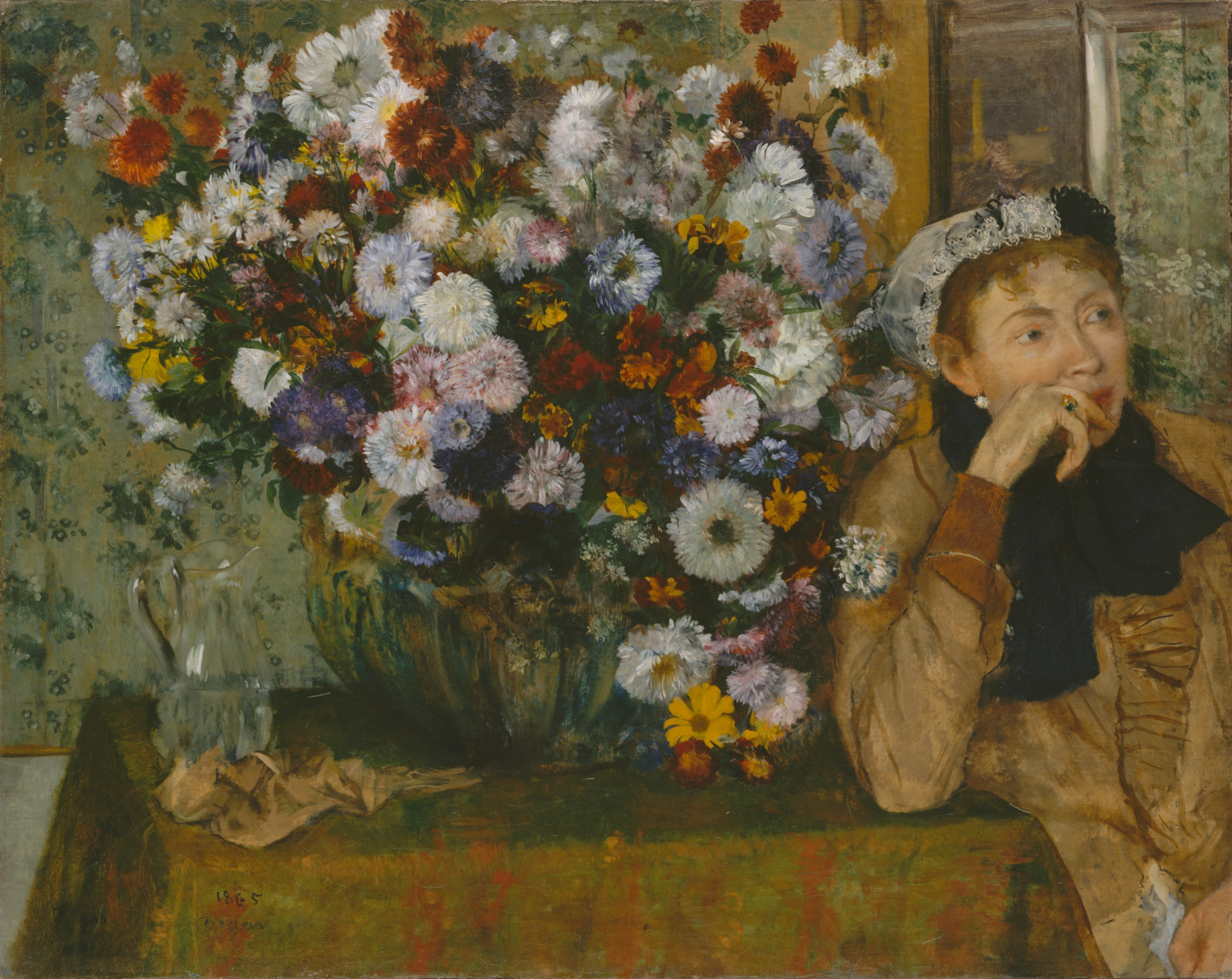 A seated woman rests her hand near her mouth beside a large bouquet of white, pink, and red flowers.