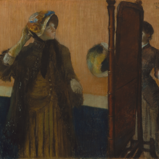 A woman adjusts a decorated hat beside a tall mirror, with another figure partly visible beyond it.
