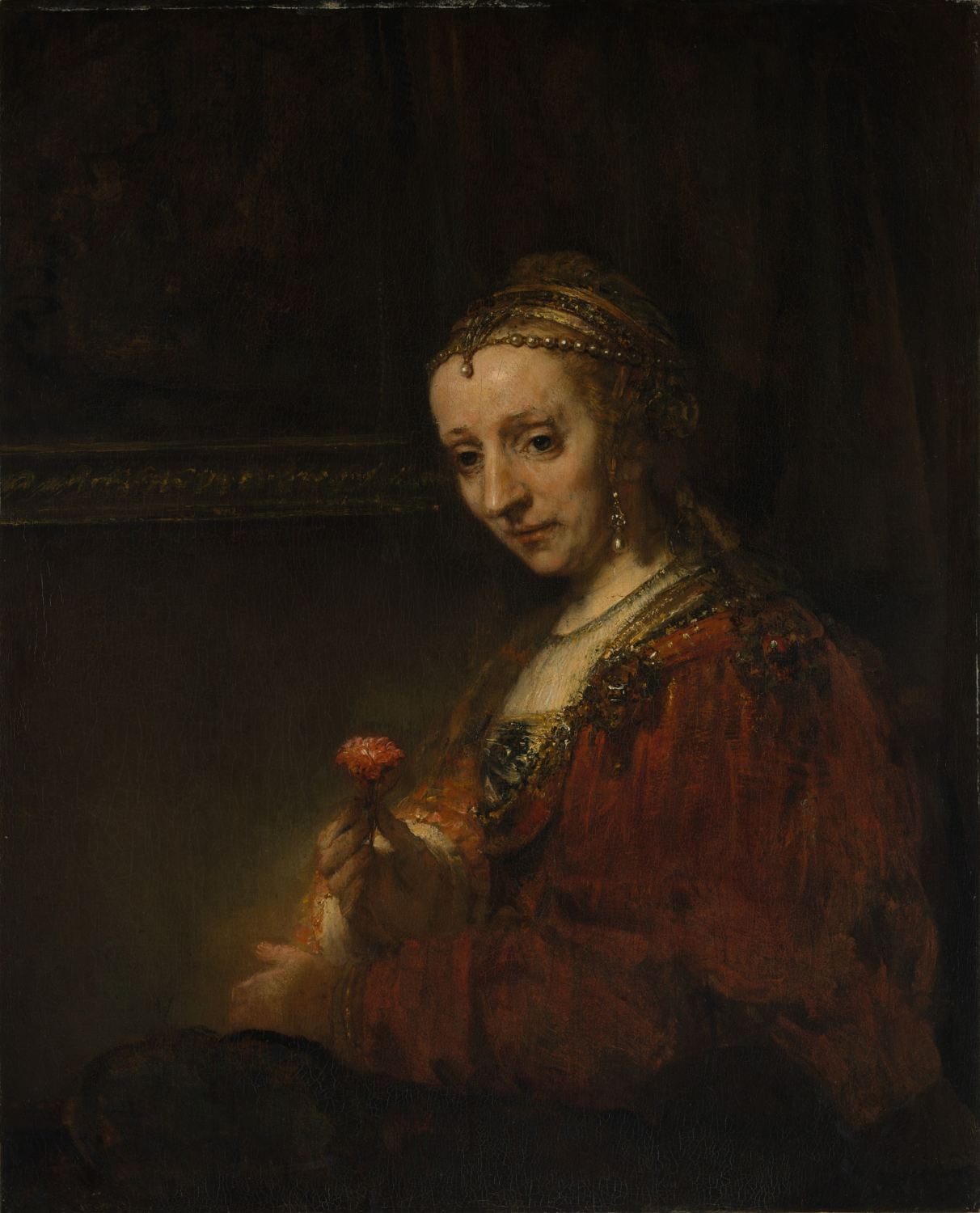 Woman with a Pink by Rembrandt van Rijn