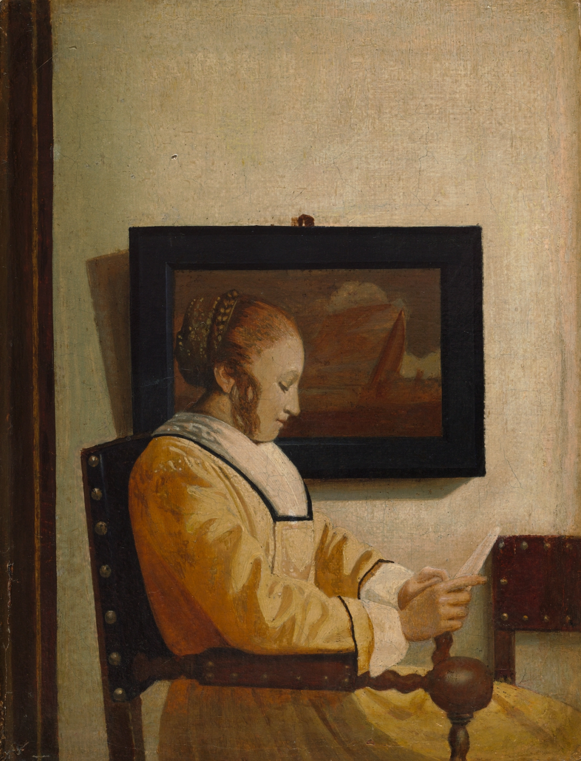 A Young Woman Reading by a probable imitator of Johannes Vermeer